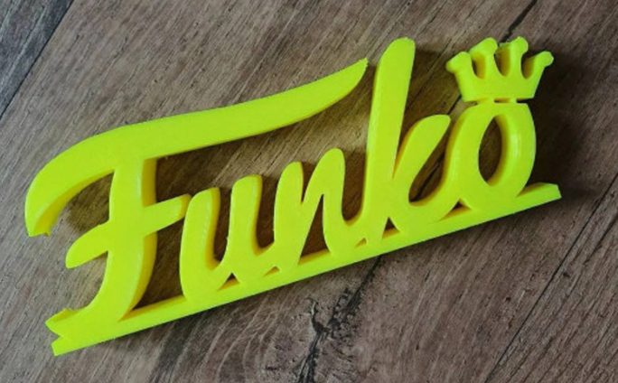 Funko Pop Logo on Wooden Surface